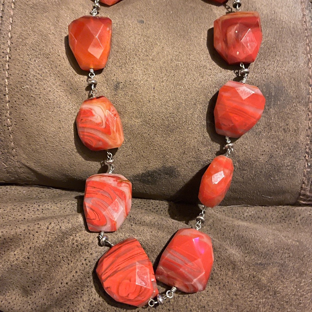 Red and white chunky stone ( not sure if stone, coral or glass )